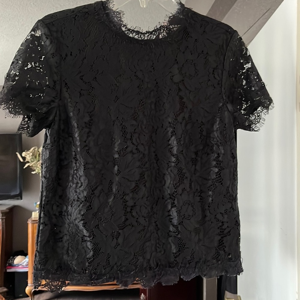 Lace top with beautiful detailed buttons in the back